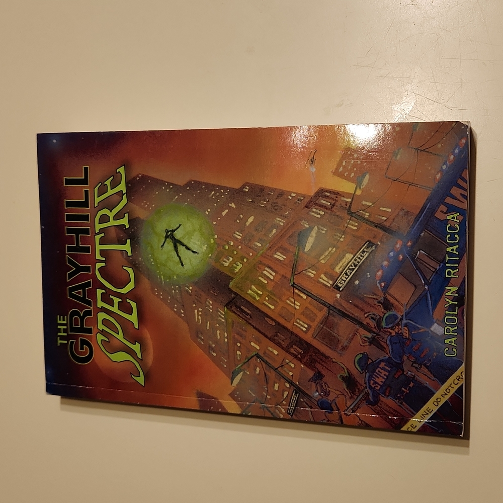 "The Grayhill Spectre" by Caroline Ritacca, paperback book.